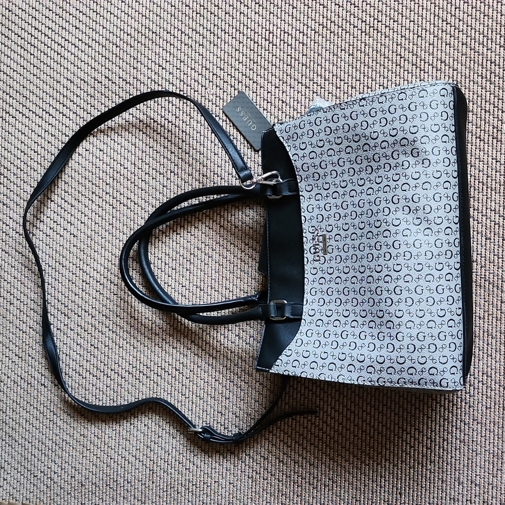 Guess purse black and gray hand bag with a cross body strap for women.